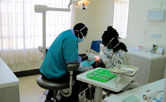 Vincent and Winnie working with patient